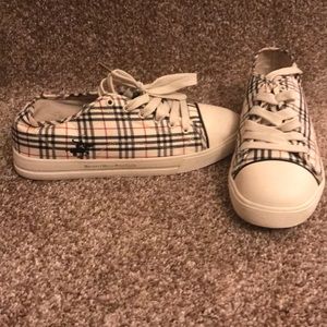 Tan, black and red sneakers